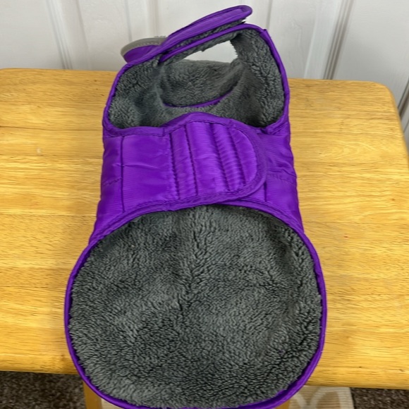 Purple with grey lining dog jacket size small. Has 2 velcro straps. Pocket front - Picture 4 of 5